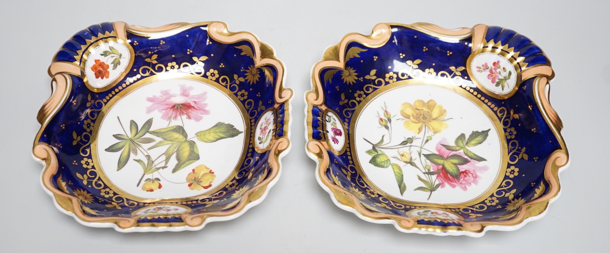A pair of English porcelain shell shaped dessert dishes, c.1820-25, with floral decoration